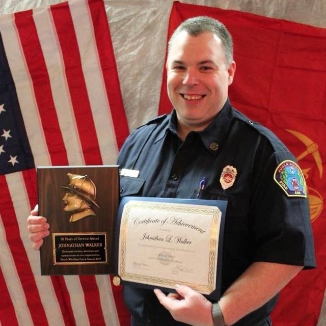 Johnathan receiving an award for his work