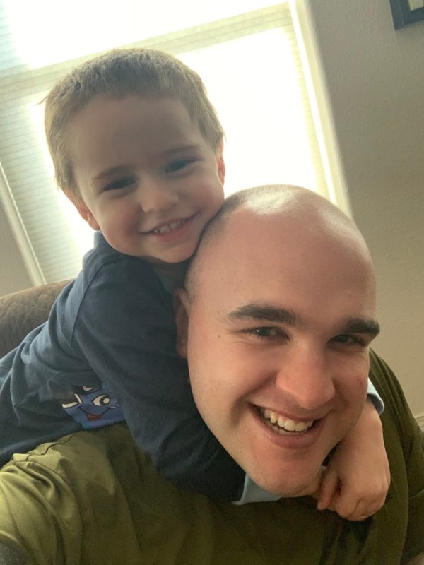 Zebulun giving his two-year old son a piggy back ride