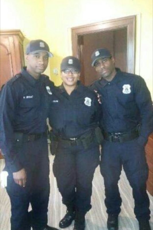 Dares with his coworkers all of them in uniform.