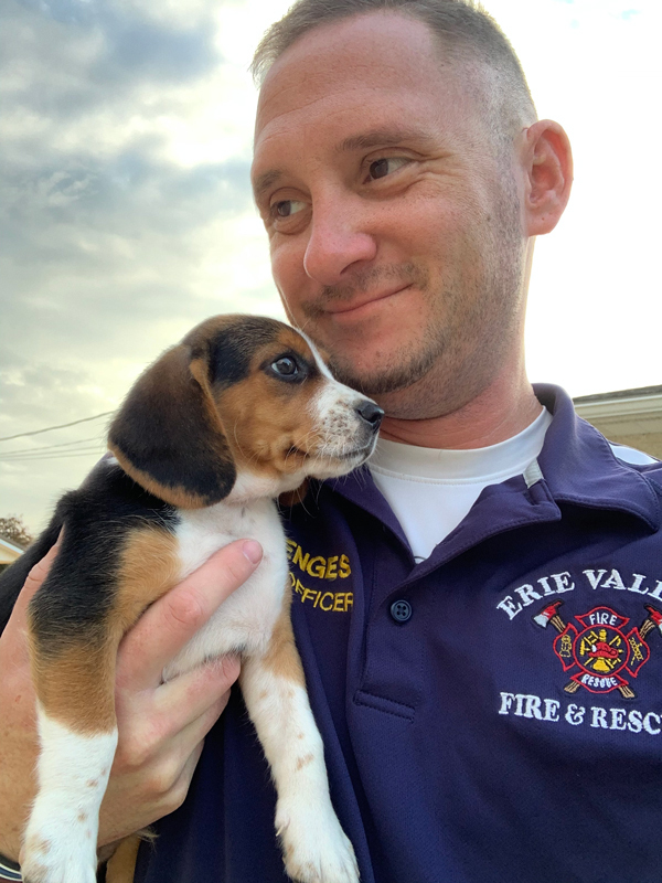 Alex Menges with beagle puppy.